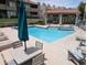 Community pool and spa with lounging and seating areas for residents at 1820 E Morten Ave # 119, Phoenix, AZ 85020