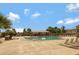 Community pool surrounded by lounge chairs and shaded seating area at 18809 E Seagull Dr, Queen Creek, AZ 85142