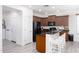 Kitchen featuring granite countertops, a breakfast bar, and dark wood cabinetry at 18809 E Seagull Dr, Queen Creek, AZ 85142