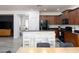 Modern kitchen layout with island seating overlooking dining and stairway at 18809 E Seagull Dr, Queen Creek, AZ 85142