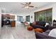 Open-concept living room with hardwood floors, modern decor, and natural light at 18809 E Seagull Dr, Queen Creek, AZ 85142