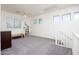 Spacious upstairs loft area with natural light and neutral tones at 18809 E Seagull Dr, Queen Creek, AZ 85142