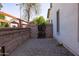 Low maintenance side yard with block wall and metal access gate at 18809 E Seagull Dr, Queen Creek, AZ 85142