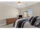 Comfortable bedroom with neutral walls, a ceiling fan, and two windows offering plenty of natural light at 1960 S Falcon Dr, Gilbert, AZ 85295