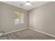 Simple bedroom design with carpet and window bringing in natural light at 1960 S Falcon Dr, Gilbert, AZ 85295