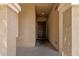 Covered front porch featuring stucco columns and a dark wood front door at 1960 S Falcon Dr, Gilbert, AZ 85295