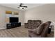 Comfortable living room features wood-look tile floors and neutral walls at 1960 S Falcon Dr, Gilbert, AZ 85295