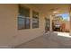 Covered patio with a ceiling fan, windows, and a sliding glass door leading to indoor living spaces at 1960 S Falcon Dr, Gilbert, AZ 85295