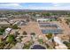 An aerial shot of large equestrian facility with riding arena, stabling, and RV parking at 20464 E Bronco Dr, Queen Creek, AZ 85142