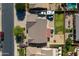 Aerial view of a landscaped home showcasing the backyard, patio, and ample parking at 20464 E Bronco Dr, Queen Creek, AZ 85142