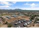 An aerial shot of extensive horse property, including facilities, parking, and neighborhood homes at 20464 E Bronco Dr, Queen Creek, AZ 85142