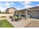 Relaxing backyard patio area with seating, BBQ, and lush green lawn at 20464 E Bronco Dr, Queen Creek, AZ 85142