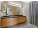 Spacious primary bathroom with double sink vanity, granite counters, and tile flooring at 20464 E Bronco Dr, Queen Creek, AZ 85142