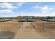 Expansive equestrian center featuring covered stalls, horse runs, and mountain views at 20464 E Bronco Dr, Queen Creek, AZ 85142