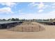 Well-maintained horse facilities featuring stables, turnouts, and spacious riding areas at 20464 E Bronco Dr, Queen Creek, AZ 85142