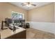 Bright office space with large window providing ample natural light and plenty of desk space at 20464 E Bronco Dr, Queen Creek, AZ 85142