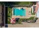 A serene pool area featuring lounge chairs, a gazebo, and well-maintained landscaping at 20464 E Bronco Dr, Queen Creek, AZ 85142