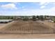 A large outdoor riding arena with excellent footing and surrounding neighborhood views at 20464 E Bronco Dr, Queen Creek, AZ 85142