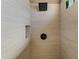 Modern shower with tiled walls, rainfall shower head, and built-in niche at 20464 E Bronco Dr, Queen Creek, AZ 85142