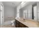 Bright bathroom featuring tile flooring, a large vanity, and a tub/shower combo, providing comfort and functionality at 2064 S Farnsworth Dr # 43, Mesa, AZ 85209