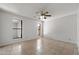 Bright bedroom with tile floors, neutral paint, multiple windows, and a ceiling fan, creating a relaxing atmosphere at 2064 S Farnsworth Dr # 43, Mesa, AZ 85209
