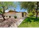 Well-maintained home featuring desert landscaping, mature trees, a lush lawn, and a private courtyard at 2064 S Farnsworth Dr # 43, Mesa, AZ 85209