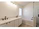 Contemporary bathroom featuring a double sink vanity, tub-shower combo, and neutral finishes at 2117 E Saltsage Dr, Phoenix, AZ 85048