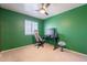 Bedroom with ceiling fan, a large window, and a workstation at 2117 E Saltsage Dr, Phoenix, AZ 85048