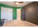 Neutral bedroom with ceiling fan, closet, and connecting bathroom access at 2117 E Saltsage Dr, Phoenix, AZ 85048