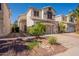 Two-story home with desert landscaping, a driveway, and a two-car garage at 2117 E Saltsage Dr, Phoenix, AZ 85048