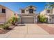 Charming two-story home with well-maintained yard and attached garage at 2117 E Saltsage Dr, Phoenix, AZ 85048