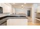 Efficient kitchen features white cabinets, and dark countertops at 2117 E Saltsage Dr, Phoenix, AZ 85048