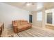 Relaxing living room with neutral walls, tile floor, soft brown sofa and decorative rug at 2117 E Saltsage Dr, Phoenix, AZ 85048