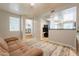 Inviting living room featuring an open floor plan to kitchen, comfortable couch, and neutral decor at 2117 E Saltsage Dr, Phoenix, AZ 85048