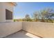 Outdoor patio space with landscape view, stucco walls, concrete floor, and clear blue sky at 2117 E Saltsage Dr, Phoenix, AZ 85048