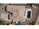Overhead view of a well-maintained tile roof, driveway, and the pool in the backyard at 2122 N Stapley Dr, Mesa, AZ 85203