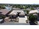 Aerial view showcasing a well-maintained home with a desert landscape, tile roof, and backyard canal at 2122 N Stapley Dr, Mesa, AZ 85203