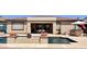 Inviting backyard with a refreshing pool, covered patio, and lush landscaping at 2122 N Stapley Dr, Mesa, AZ 85203