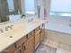 Bright bathroom featuring a double sink vanity, soaking tub, and tiled floors at 2122 N Stapley Dr, Mesa, AZ 85203