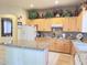 Bright kitchen featuring an island and cabinetry with decorative displays above at 2122 N Stapley Dr, Mesa, AZ 85203