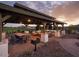 Community outdoor pavilion featuring picnic tables, barbecue grills, and lighting at 21963 E Sunset Dr, Queen Creek, AZ 85142