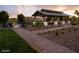 Outdoor pavilion with seating areas and a pathway, creating an inviting community gathering space at 21963 E Sunset Dr, Queen Creek, AZ 85142