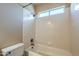 Bathroom features a tiled shower and bathtub combination at 2340 W Myrtle Dr, Chandler, AZ 85248