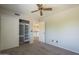Bedroom with closet, plush carpeting and views to the hallway and dining area at 2340 W Myrtle Dr, Chandler, AZ 85248