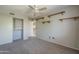 Bright bedroom features a closet, shelving, and neutral carpet at 2340 W Myrtle Dr, Chandler, AZ 85248