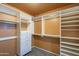 Walk-in closet features custom organizers with shelving and drawers for ample storage at 2340 W Myrtle Dr, Chandler, AZ 85248