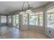Open dining area features tile flooring, many windows with views of the pool and backyard at 2340 W Myrtle Dr, Chandler, AZ 85248
