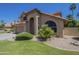 Charming two-story home featuring a well-manicured lawn, a two car garage and a terra cotta roof at 2340 W Myrtle Dr, Chandler, AZ 85248