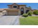 Charming two-story home featuring a well-manicured lawn, a two car garage and a terra cotta roof at 2340 W Myrtle Dr, Chandler, AZ 85248