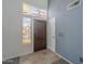 Inviting foyer featuring a colorful stained glass sidelight, a tile floor, and a high ceiling at 2340 W Myrtle Dr, Chandler, AZ 85248